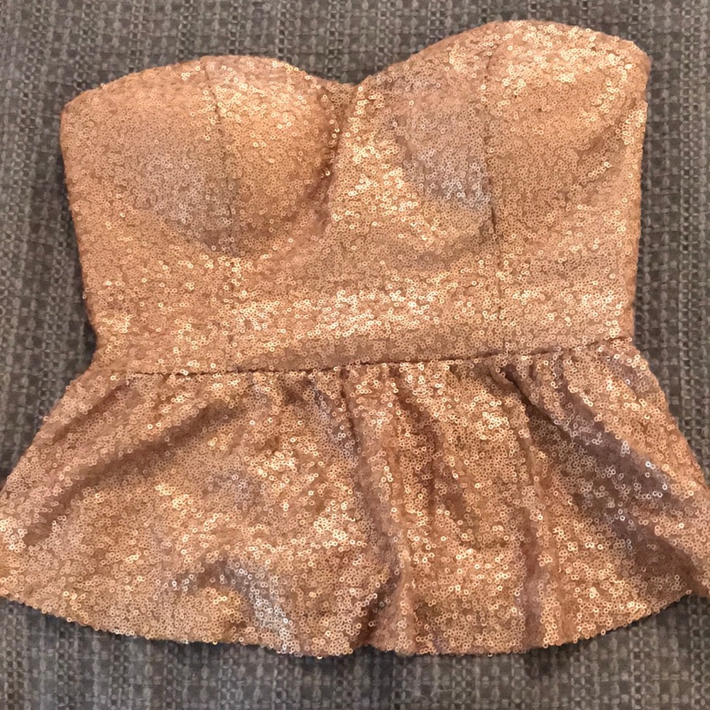 Gold sequin tube top with baby doll bottom.